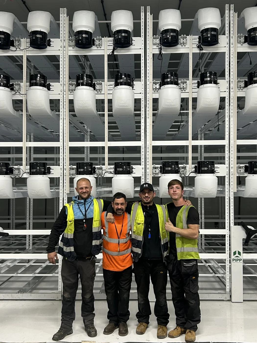 Industrial project team in safety clothing